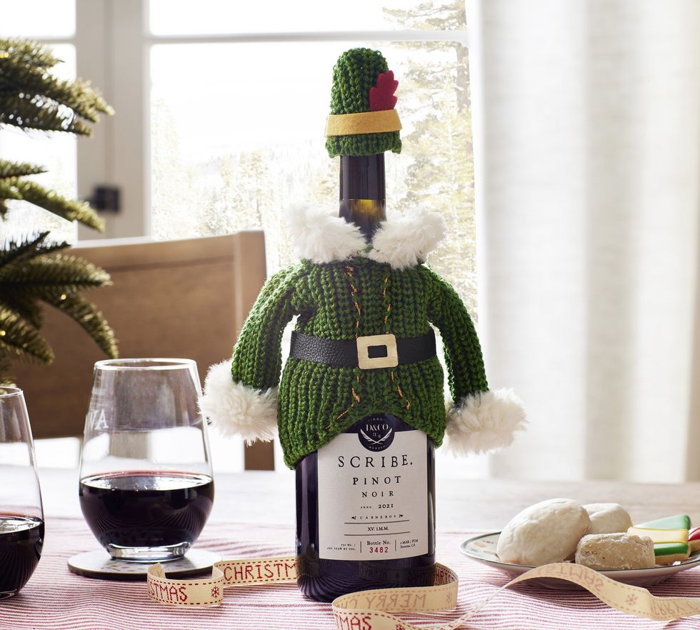 A bottle of pinot noir is wearing the Elf wine jacket.