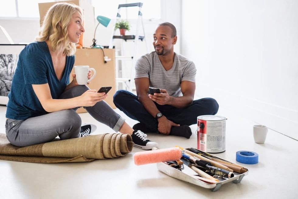 A couple discusses redecorating a room