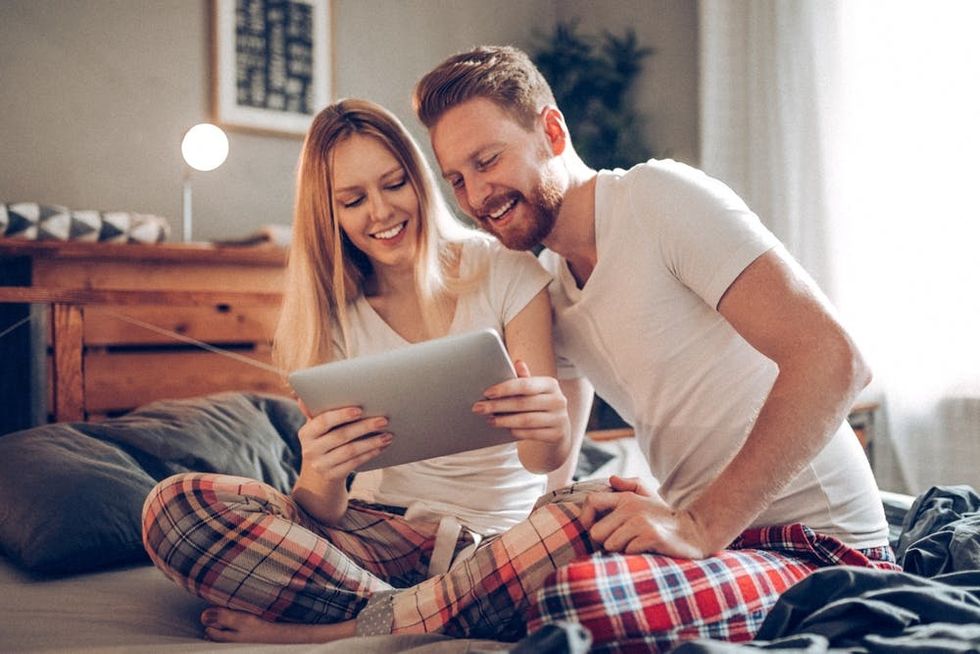 A couple looks at a website together