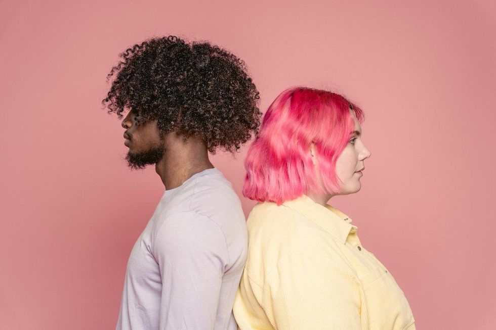 a couple standing with their backs together when to end a relationship