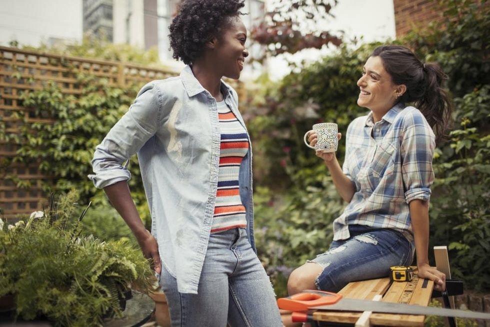 A couple takes a break on a woodworking project