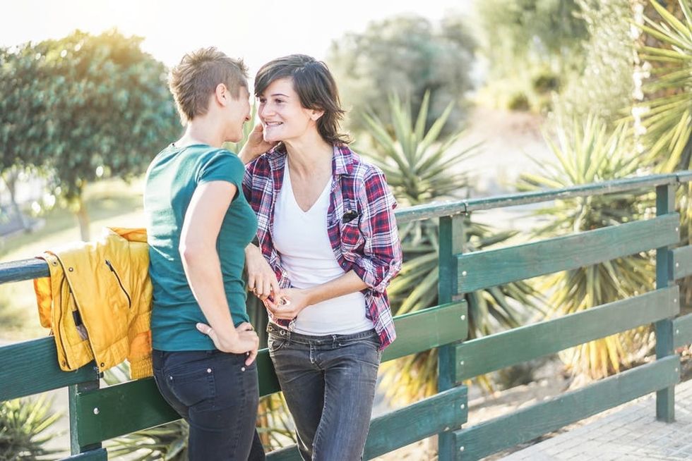 A couple talks in a park