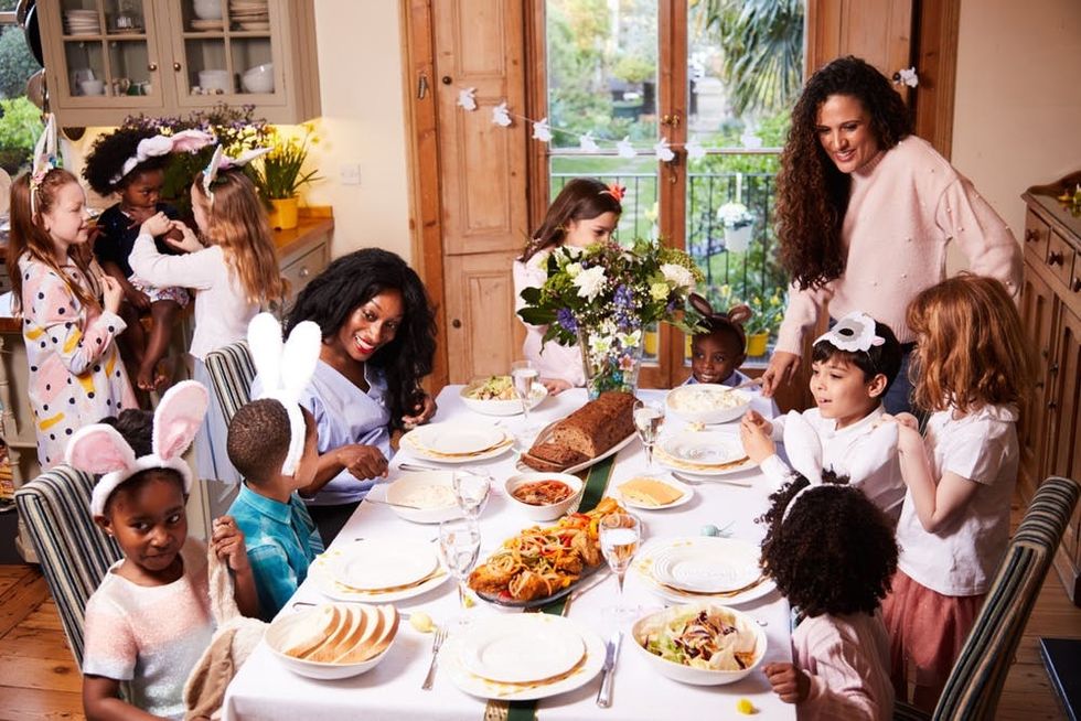 A family enjoys a holiday meal with fried fish
