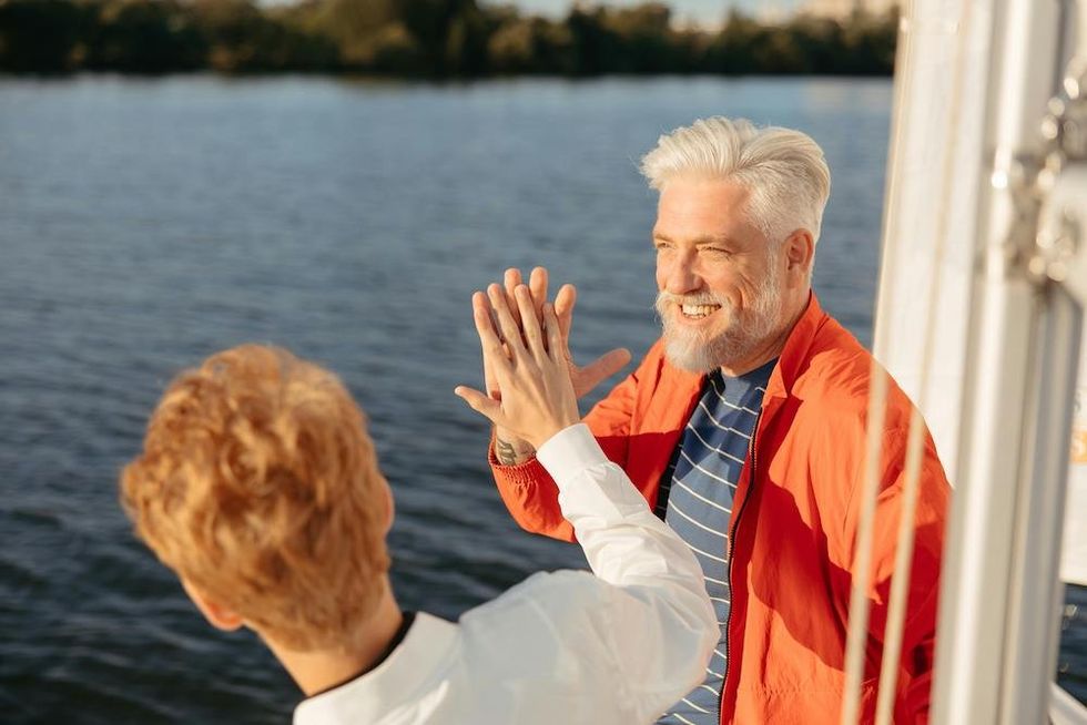 a father and a son high fiving