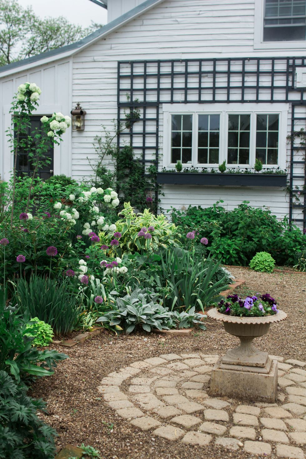 a front yard with a garden