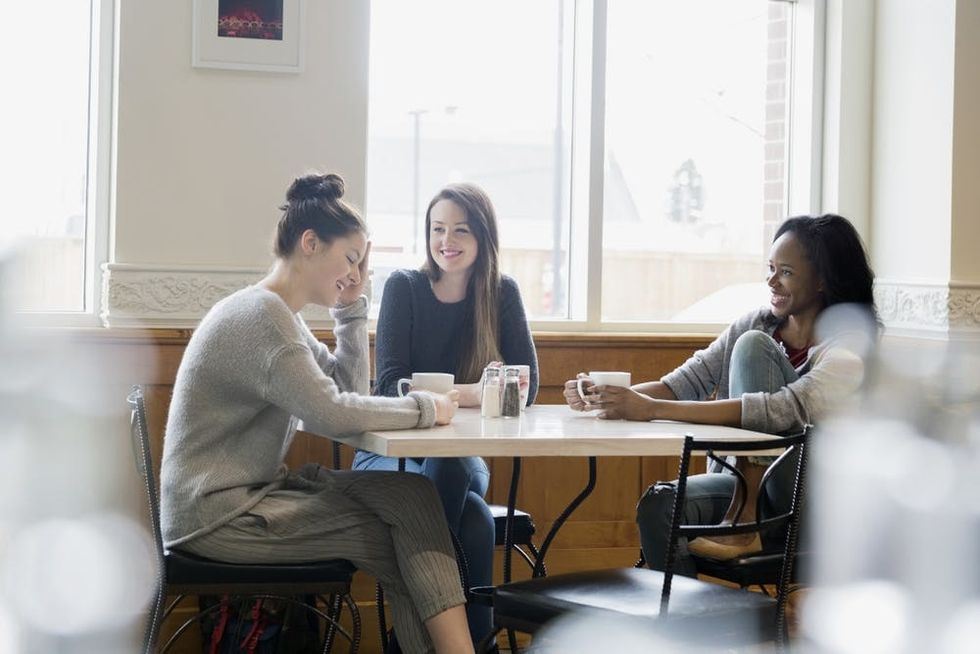 A group of friends meet in a cafe