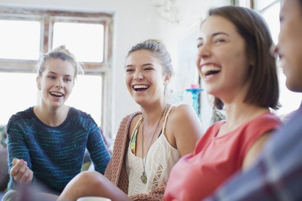A group of women laughs together