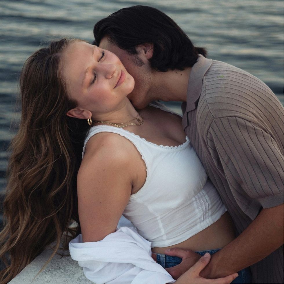 a man kissing a woman