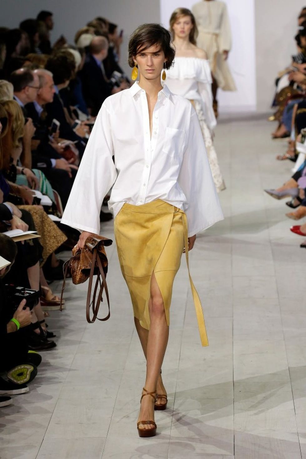 A model walks the runway at the Michael Kors Spring 2016 Runway Show during New York Fashion Week: The Shows at Spring Studios on September 16, 2015 in New York City.