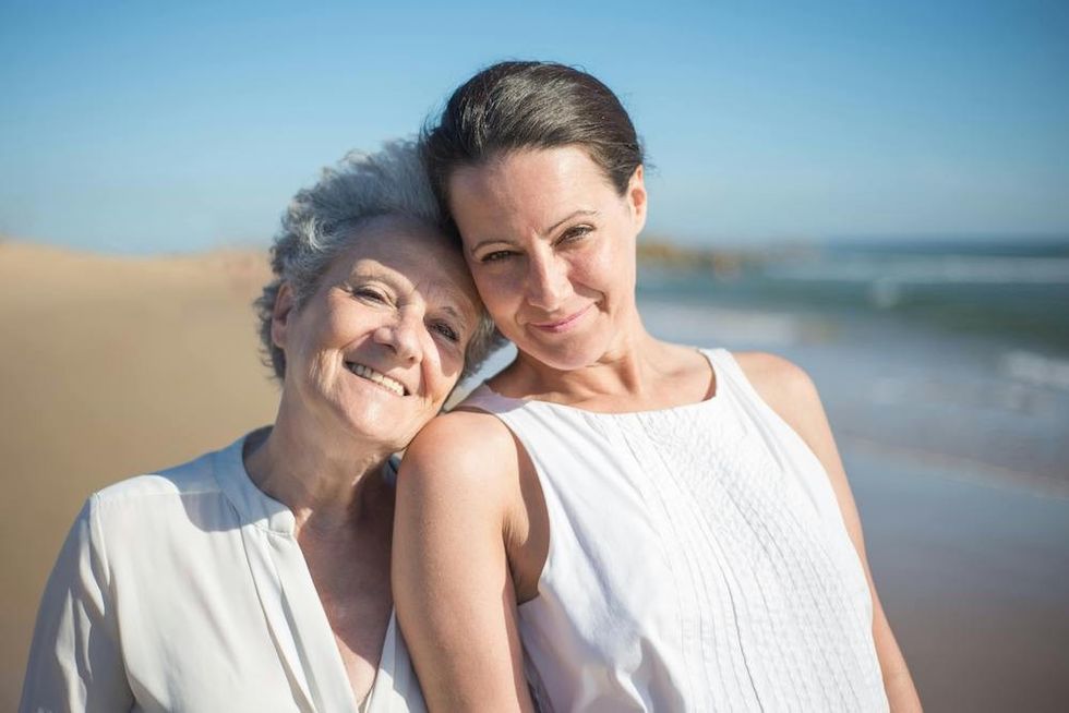 a mother and a daughter at the beach
