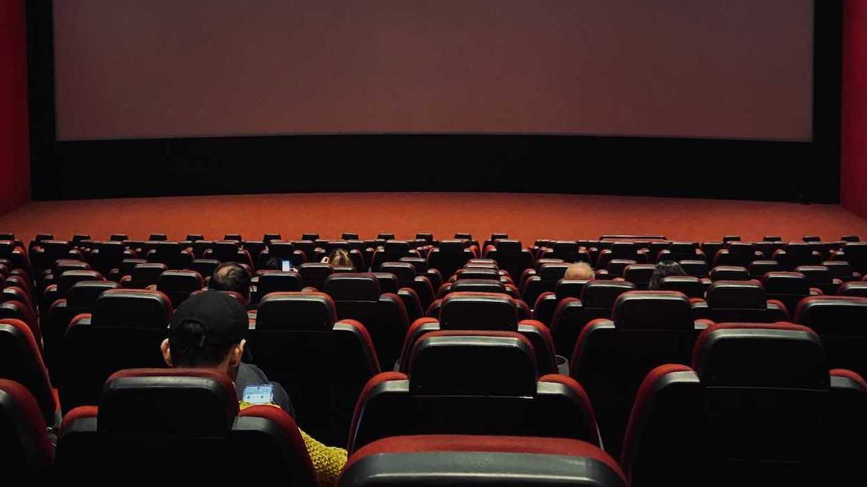 a movie theater with a black screen sunflower child movie
