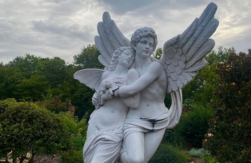 a sculpture in a garden