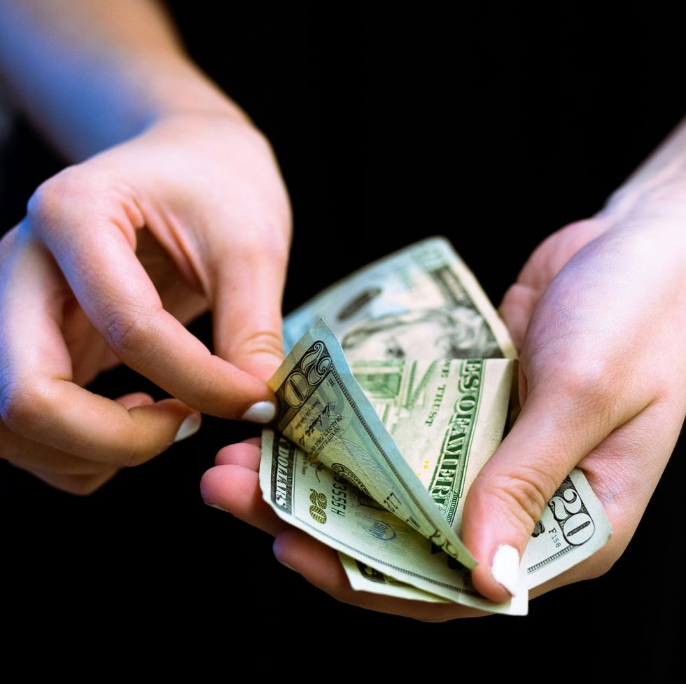 a woman counting money
