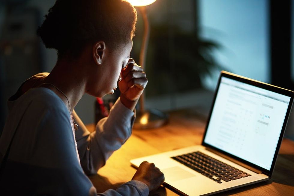 A woman is stuck working late again