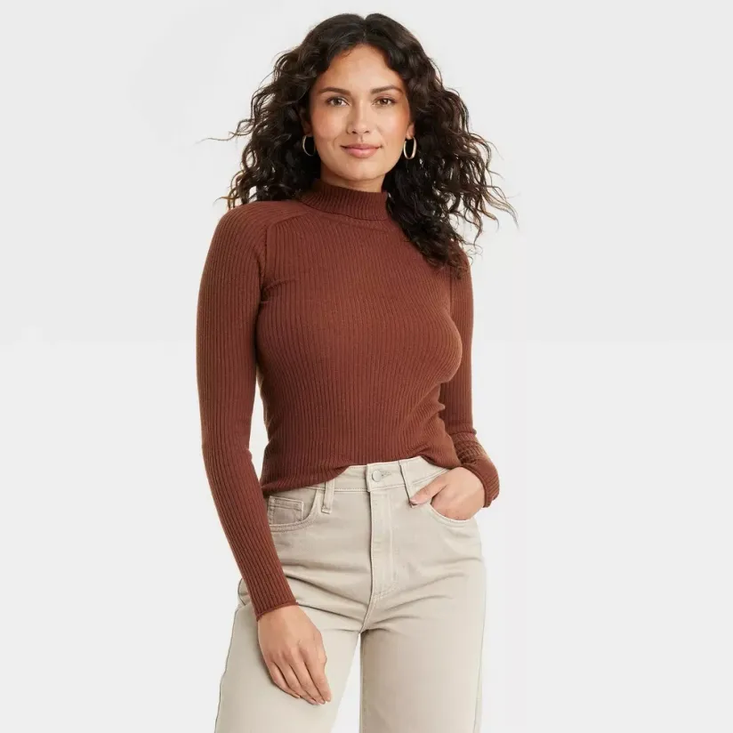 https://www.brit.co/media-library/a-woman-is-wearing-a-turtleneck-sweater.webp?id=47868808&width=824&quality=90