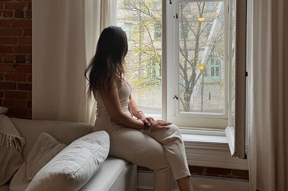 a woman looking out the window