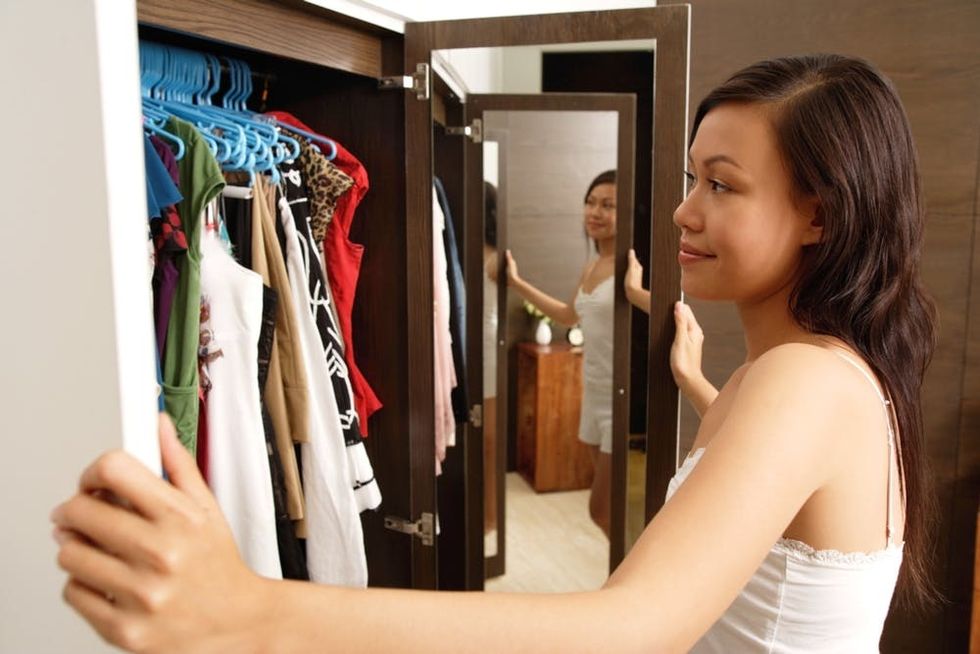 A woman looks into her closet
