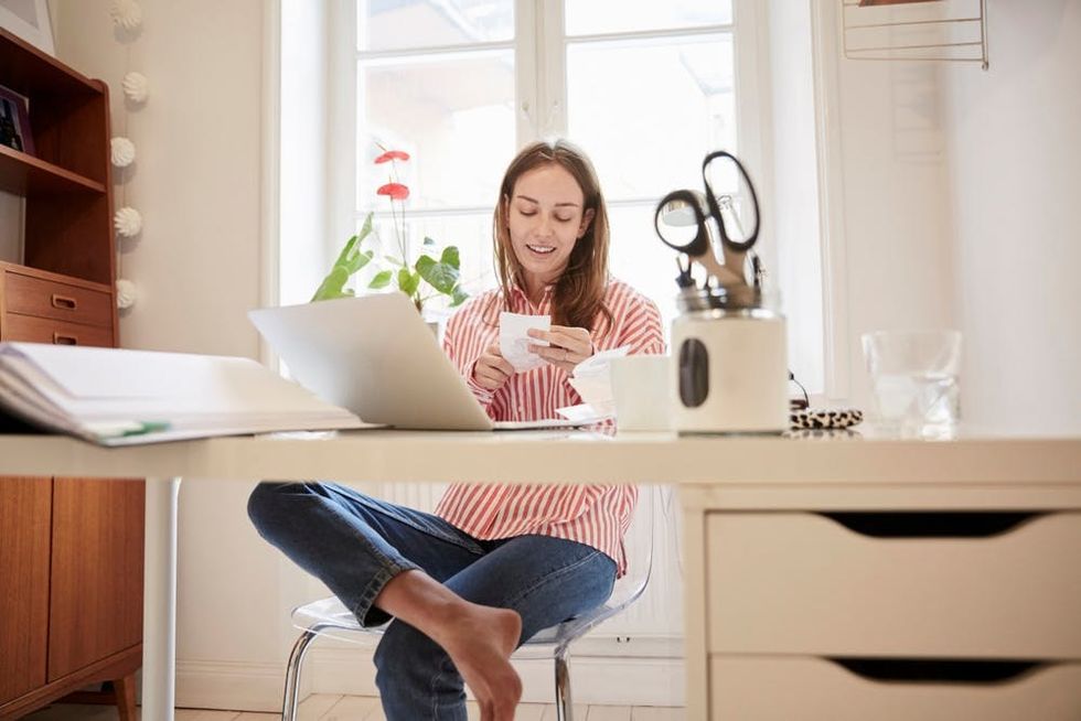 A woman looks over paperwork