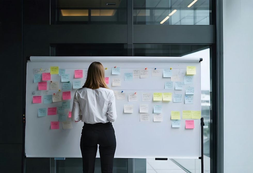 a woman organizing goals and priorities at work