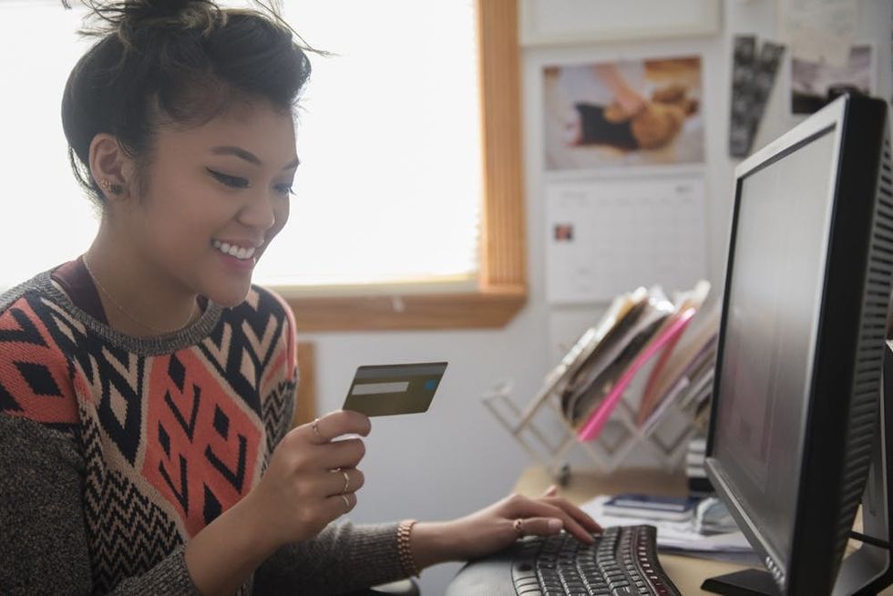 A woman pays a bill online