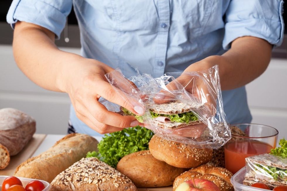 A woman prepares fresh packed lunches