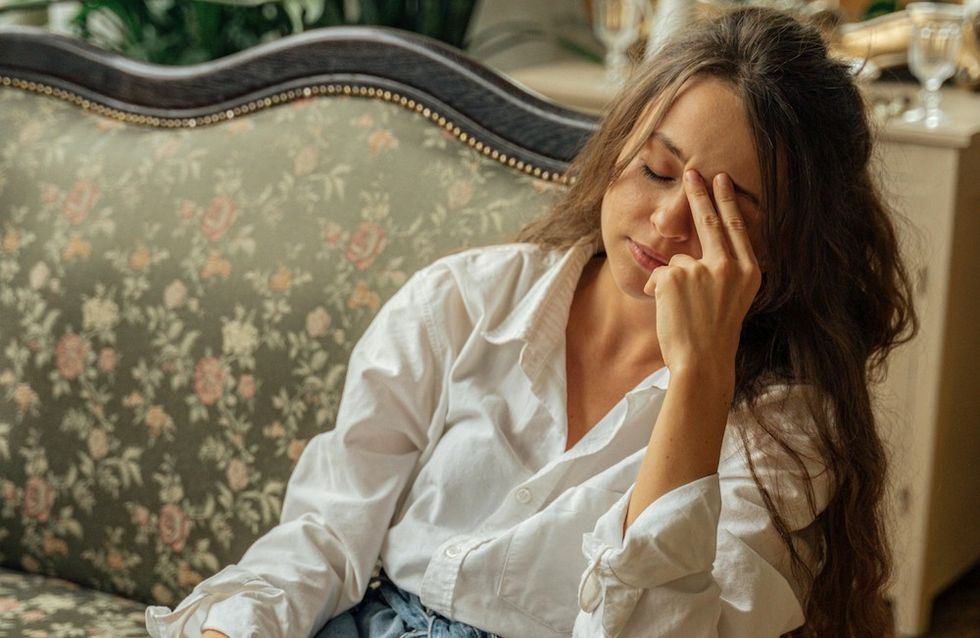 a woman stressed out on the couch