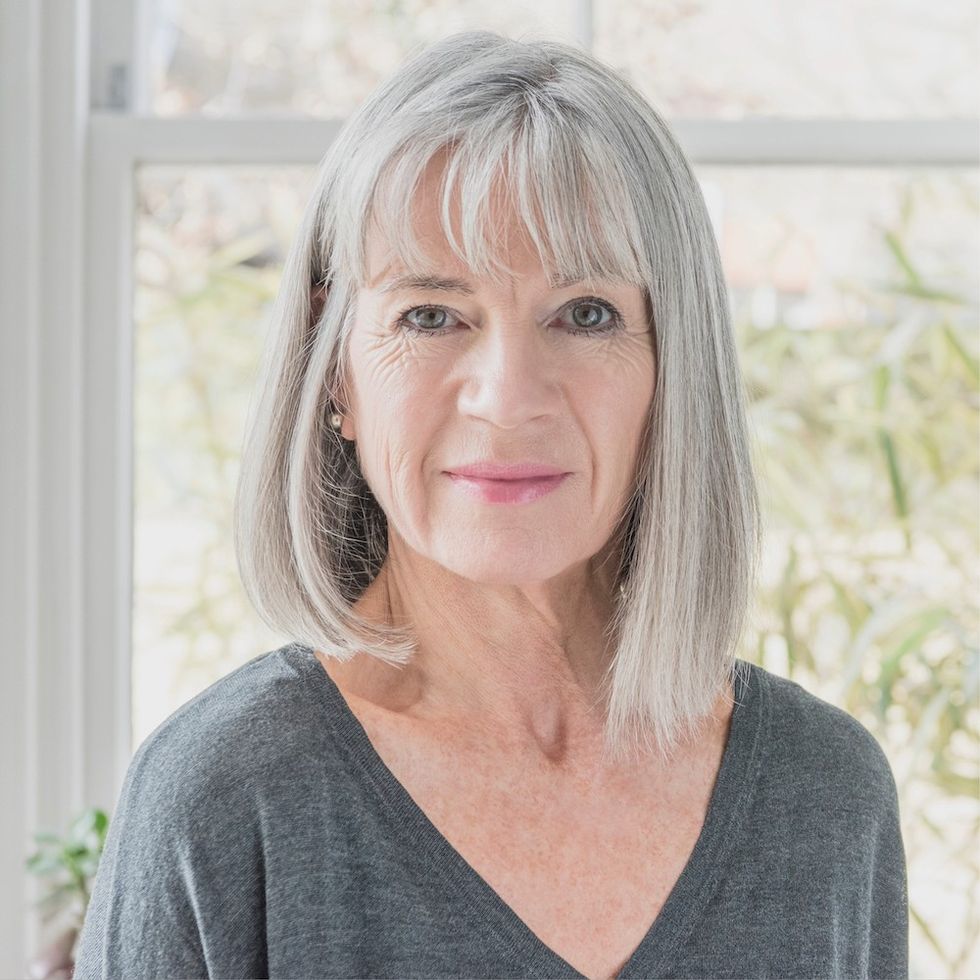 a woman with a gray bob and bangs