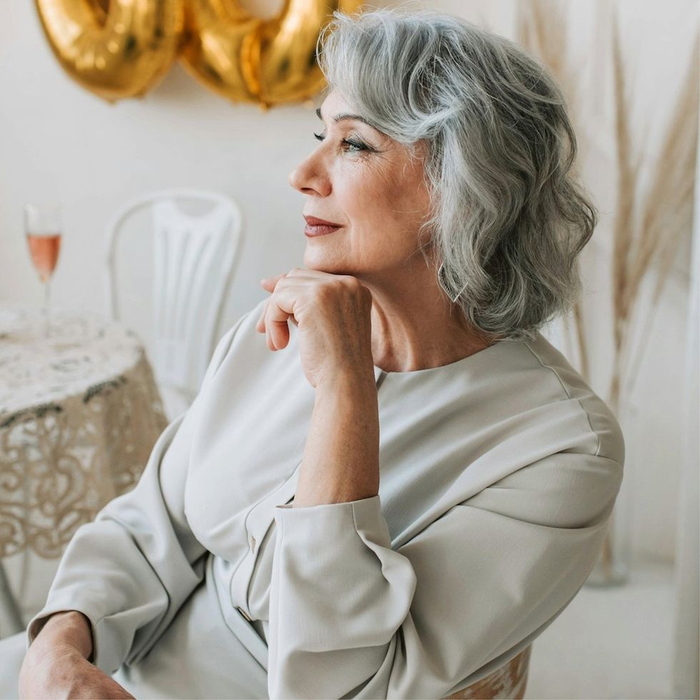 a woman with a gray wavy bob hairstyle