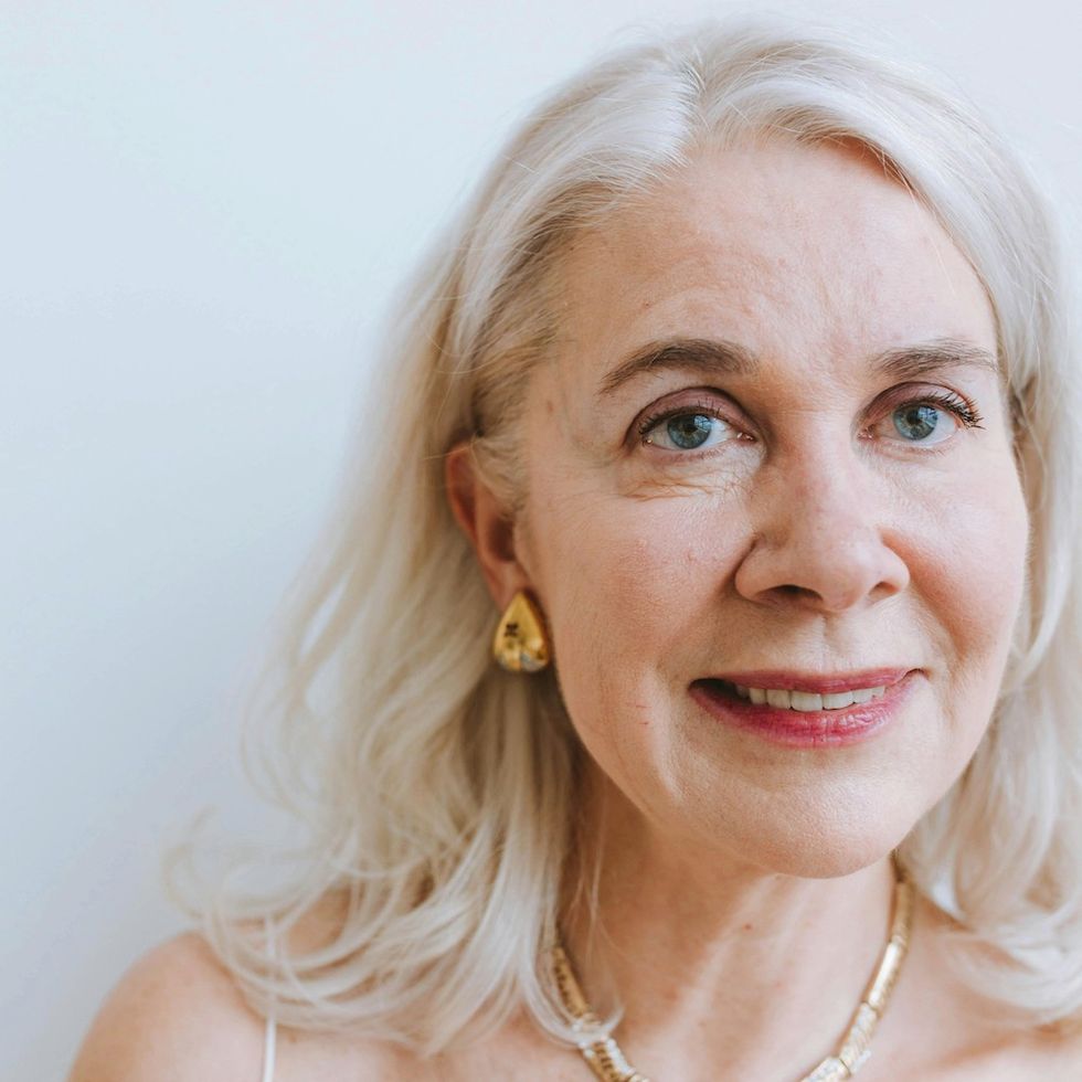 a woman with a wavy gray lob hairstyle