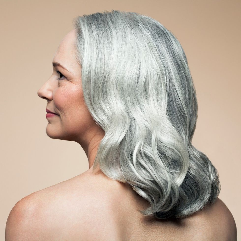 a woman with a wavy gray lob hairstyle