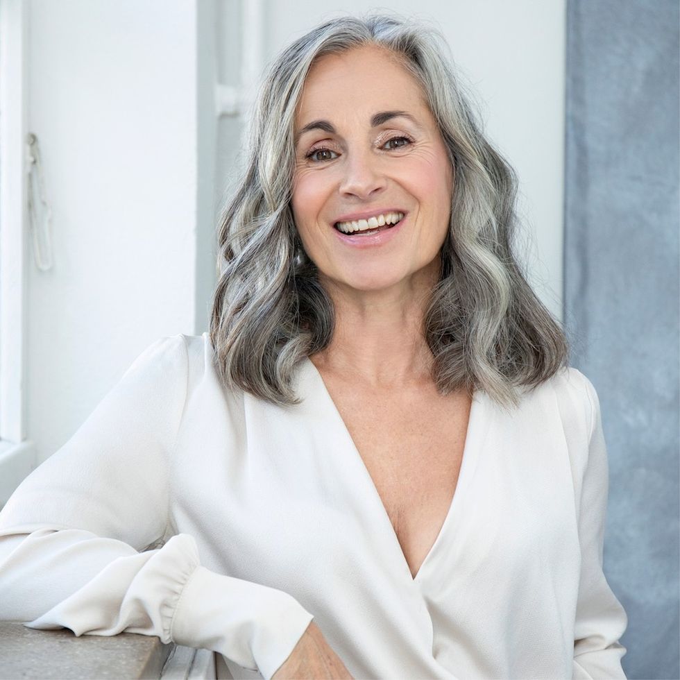 a woman with a wavy gray lob hairstyle
