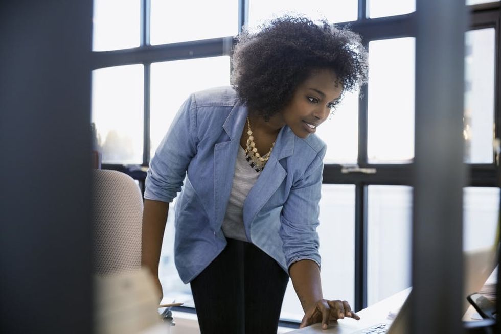 A woman works on a laptop