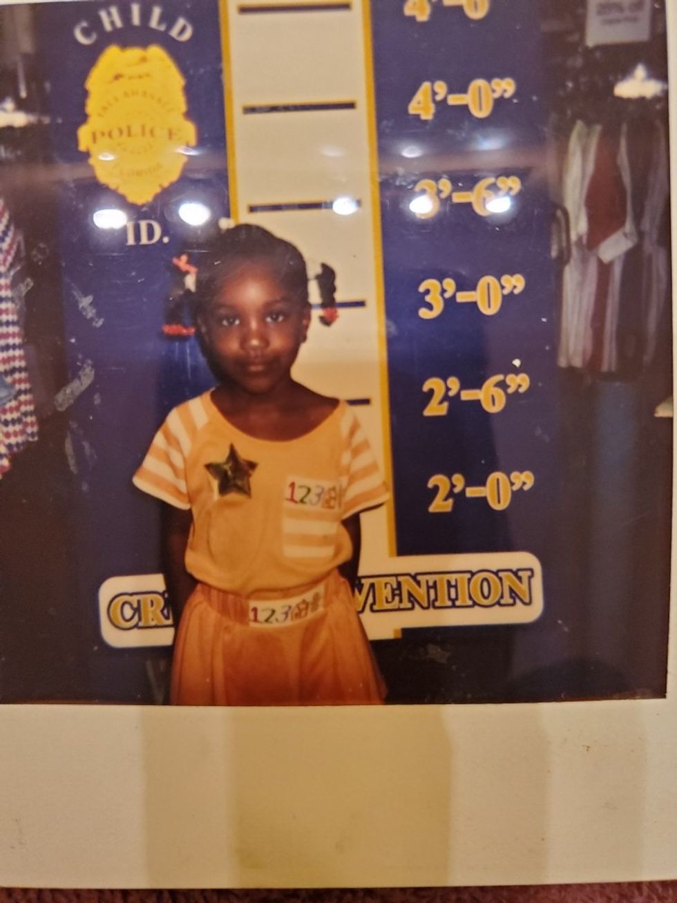 a young girl posing for a photo