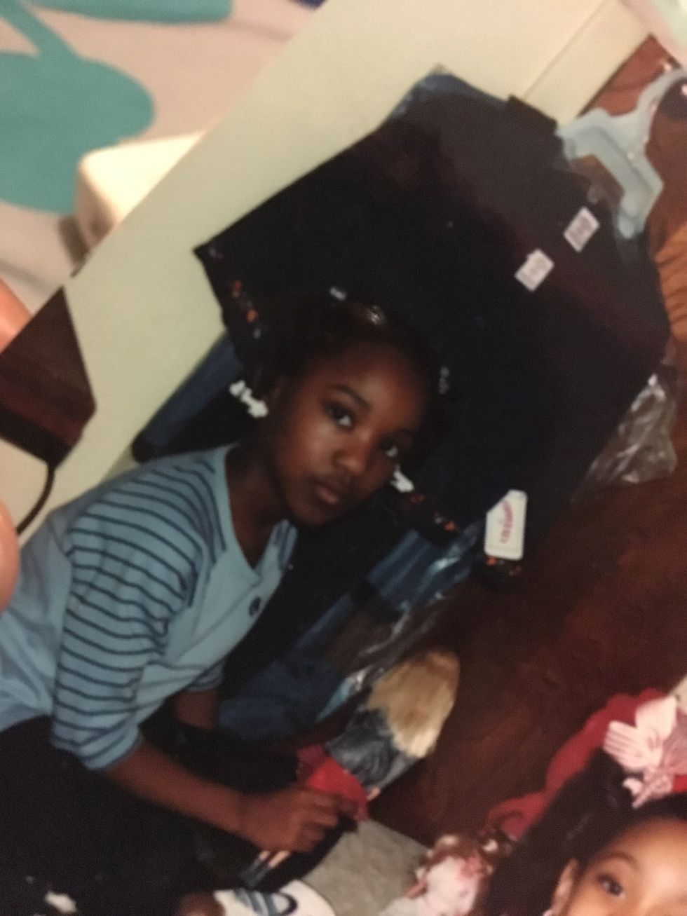 a young girl posing for a photo