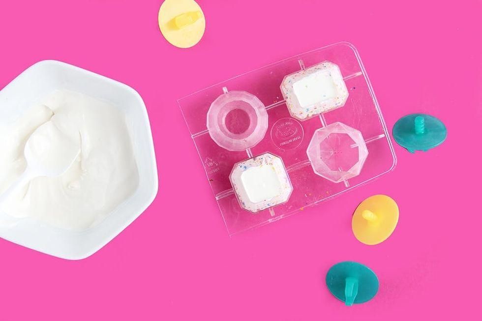 adding chocolate overtop of glitter