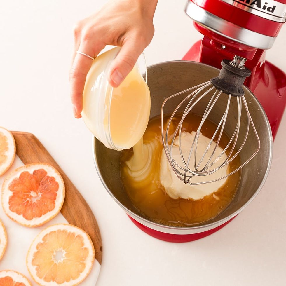 adding condensed milk cream cheese and gelatin into the mix