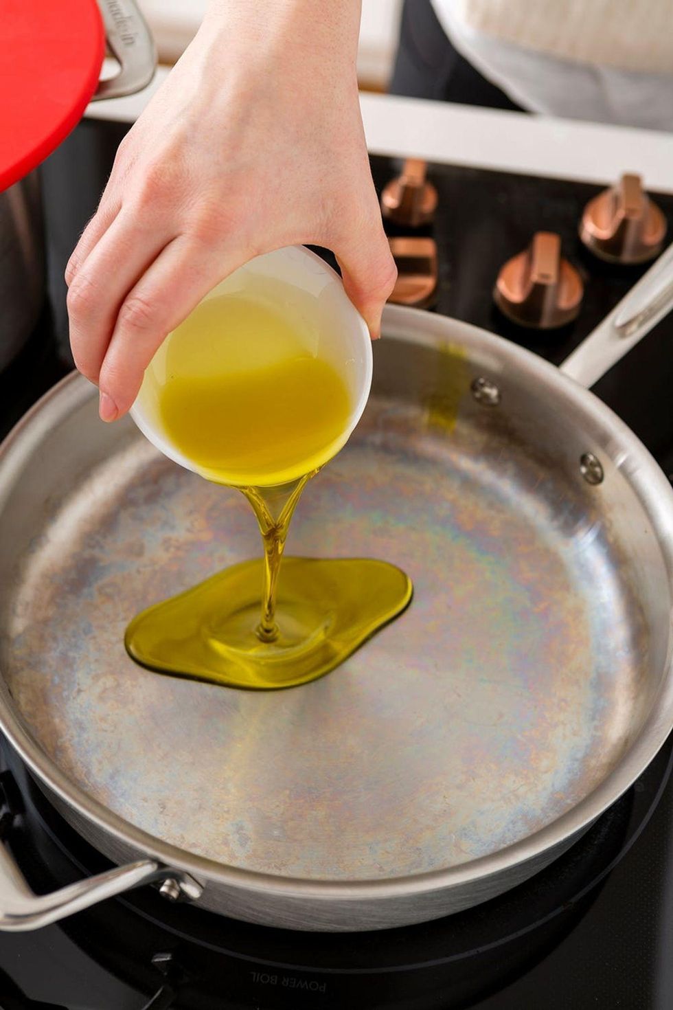 adding oil to the pan