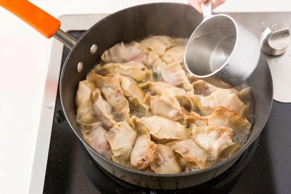 adding water into the pan