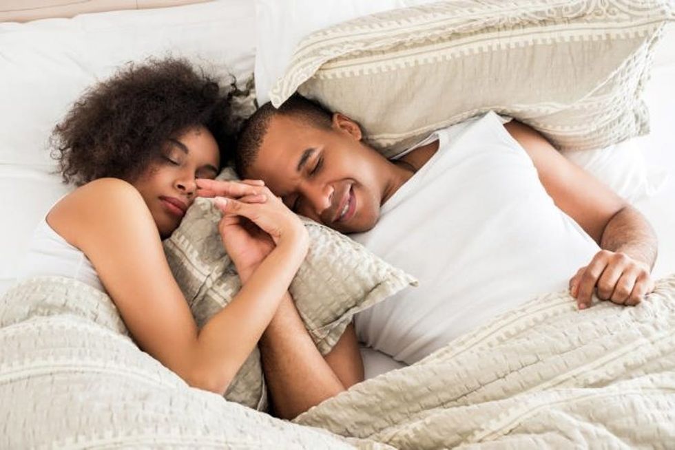 African American couple sleeping.