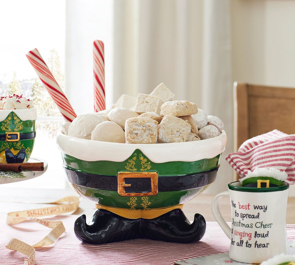 An Elf candy bowl sits on a table.
