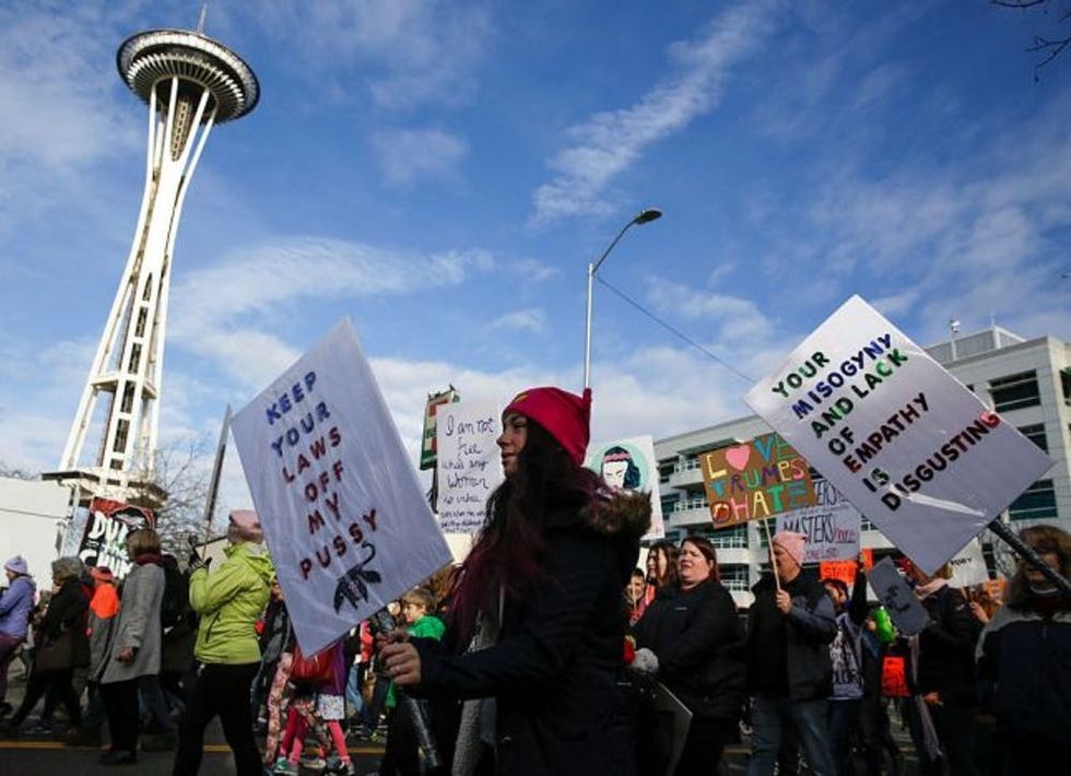 An estimated 120,000 people participate in the Women's March in Seattle, Washington, on January 21, 2017. Led by women in pink "pussyhats," hundreds of thousands of people packed the streets of Washington and other cities Saturday in a massive outpouring of defiant opposition to America's hardline new president, Donald Trump. / AFP / Jason Redmond (Photo credit should read JASON REDMOND/AFP/Getty Images)