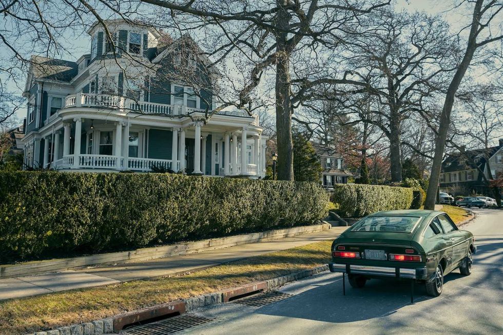 an old house with a car outside