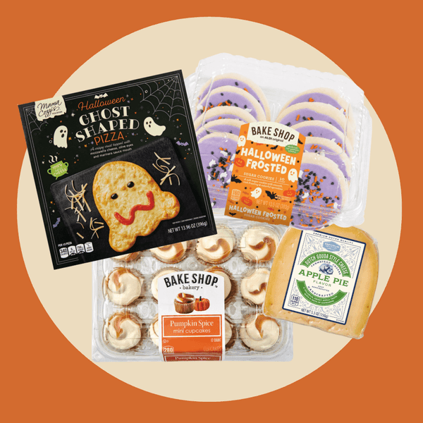 Assorted Halloween-themed treats including ghost pizza, cookies, cupcakes, and apple pie cheese.