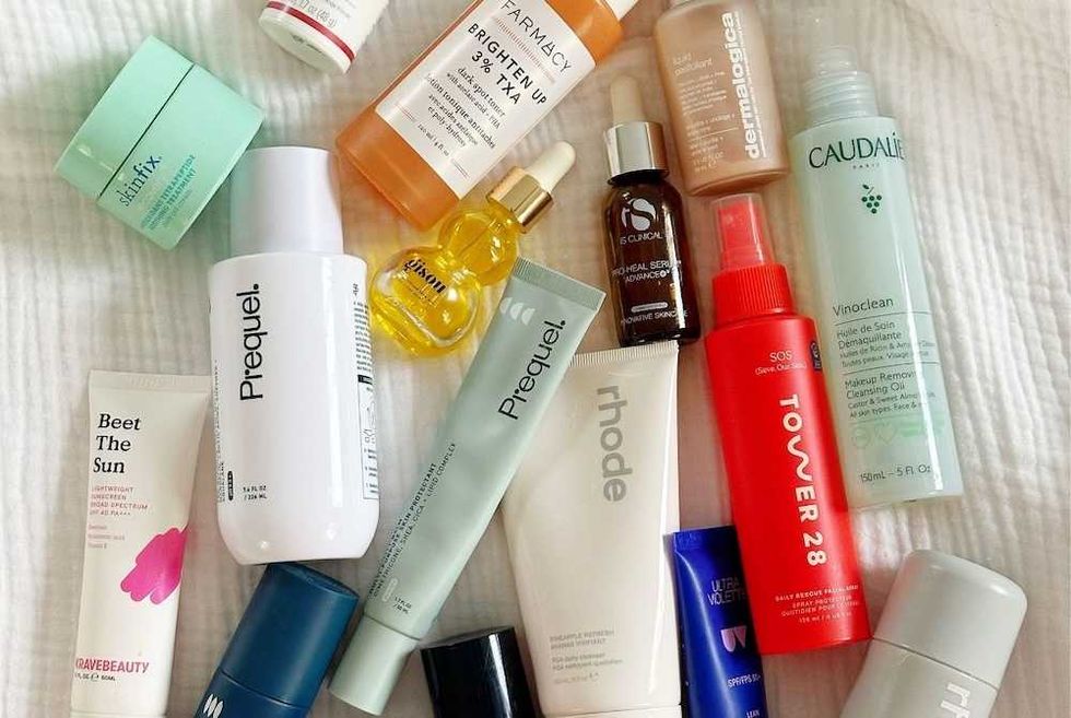 Assorted skincare products arranged on a white surface.