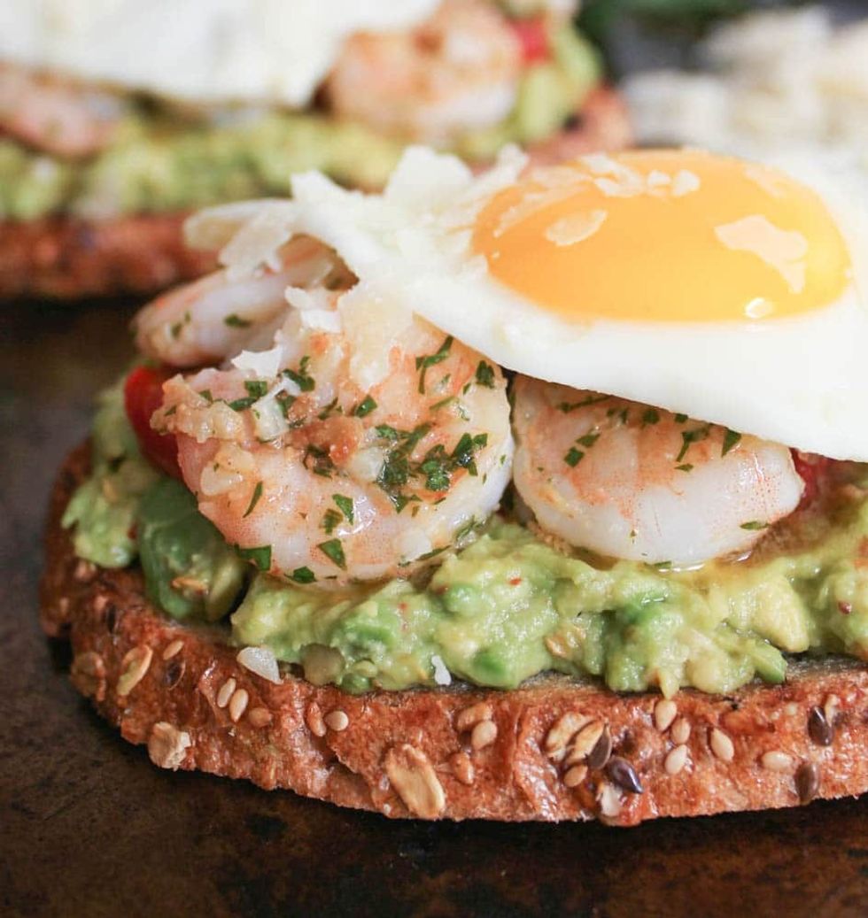 Avocado Toast With Charred Tomatoes, Garlic Shrimp and Fried Egg