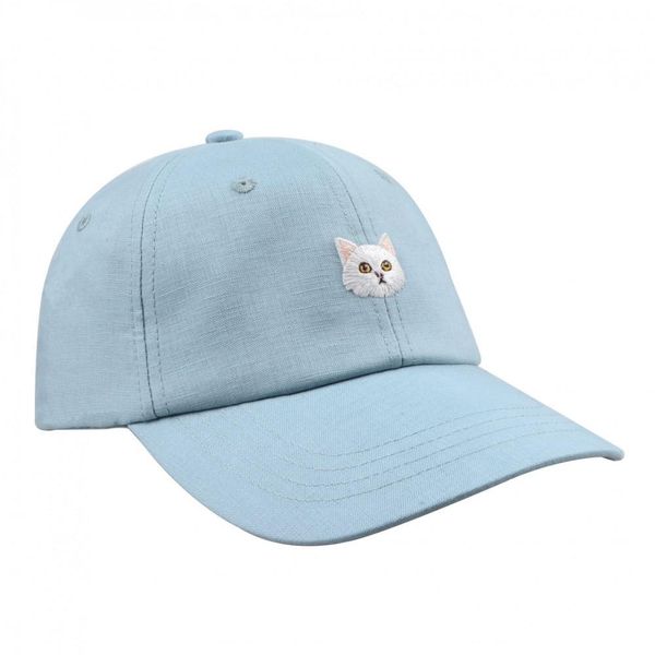 baby blue baseball cap with white cat on the front