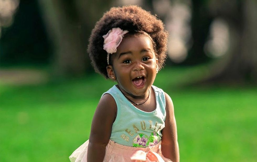 baby girl playing in a park