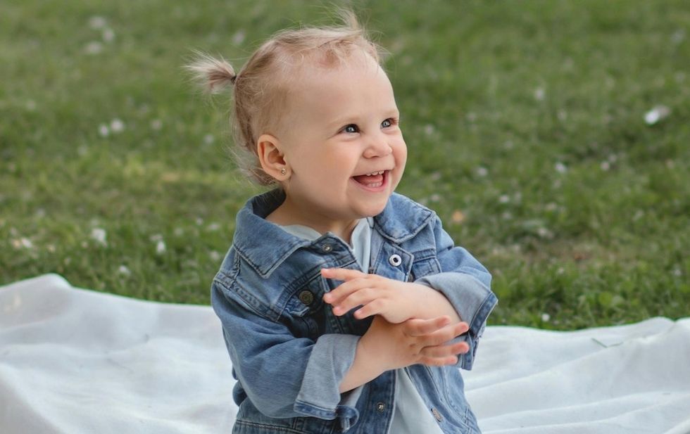 baby girl playing in a park