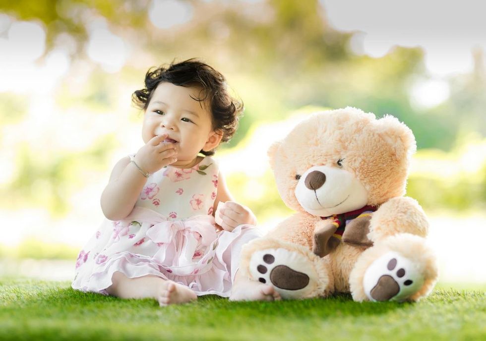 baby girl with a teddy bear