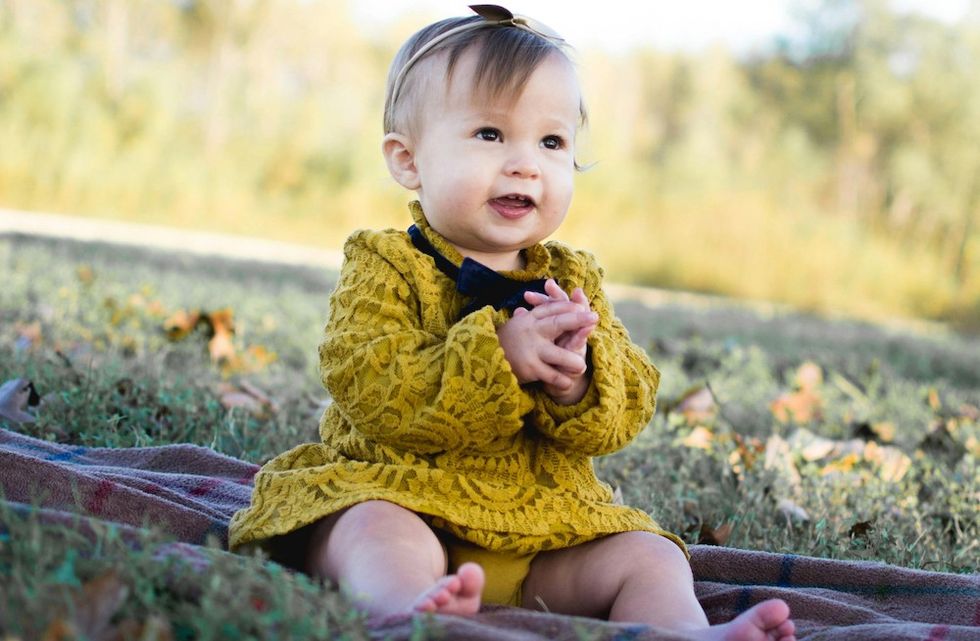 baby sitting in the grass